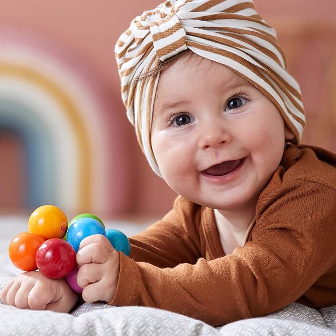 HABA Magica Wooden Grasping Toy Rattle - Baby Teething & Sensory Toy | This wooden teether helps babies develop motor skills and sensory exploration, making it a great Montessori baby gift.