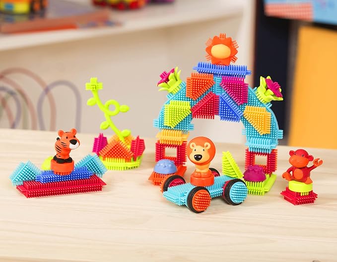 Battat Bristle Blocks Jungle Adventures, 54-Piece STEM Building Set | STEM interlocking stacking blocks with toy animals, flowers, wheels, and reusable storage bucket for pretend play, 2+ Years