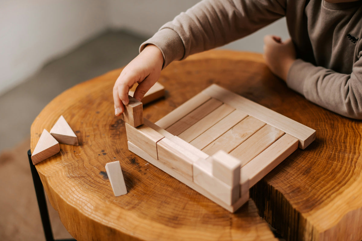 Child solving puzzle, brain development and problem-solving activity