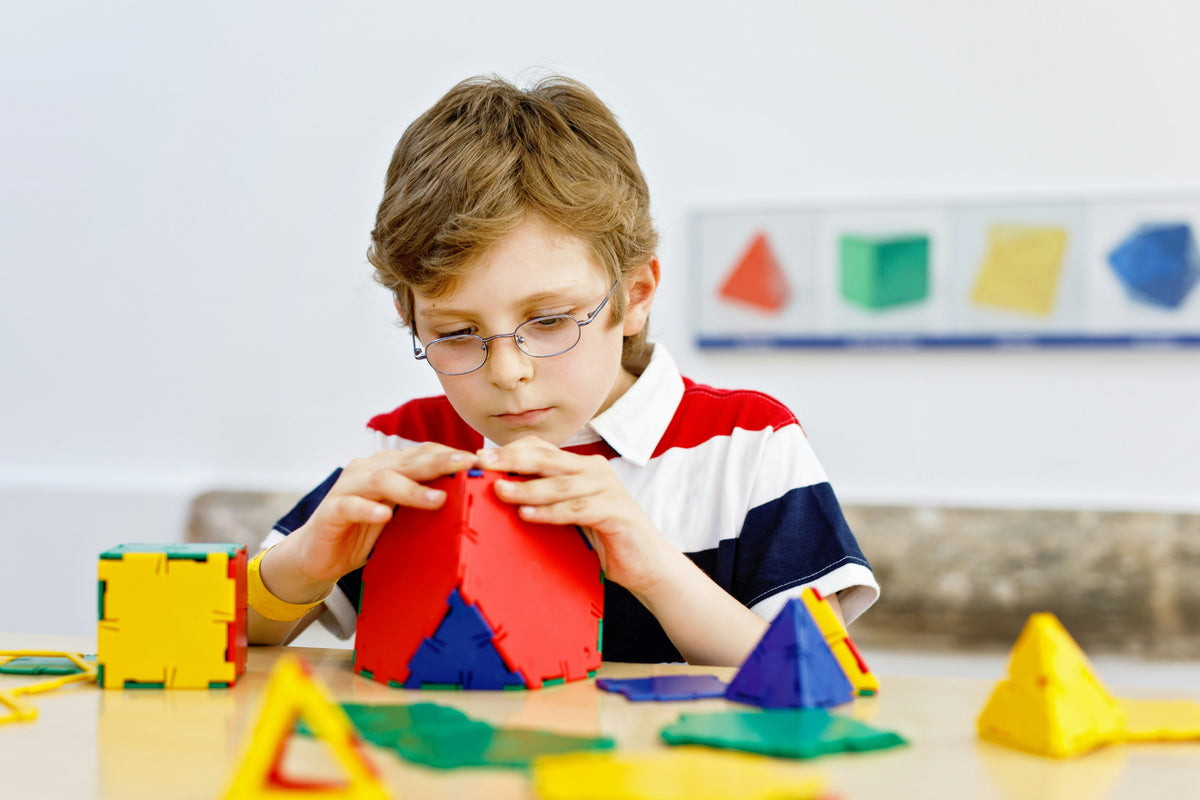 child solving shape puzzle, kids problem solving learning toy, hands-on thinking activity