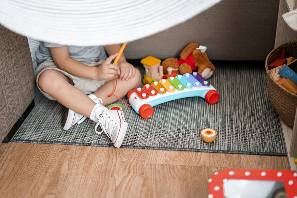 Child engaged in open-ended play, creative imagination activity