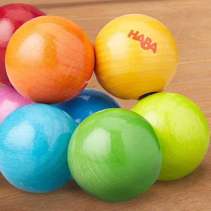 HABA Magica Wooden Grasping Toy Rattle - Baby Teething & Sensory Toy | This wooden teether helps babies develop motor skills and sensory exploration, making it a great Montessori baby gift.