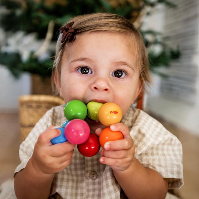 HABA Magica Wooden Grasping Toy Rattle - Baby Teething & Sensory Toy | This wooden teether helps babies develop motor skills and sensory exploration, making it a great Montessori baby gift.