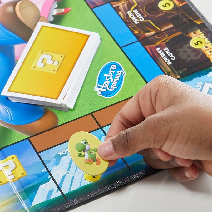 Monopoly Junior Super Mario Edition Board Game, Fun Kids' Ages 5 and Up, Explore The Mushroom Kingdom as Mario, Peach, Yoshi, or Luigi (Amazon Exclusive)
