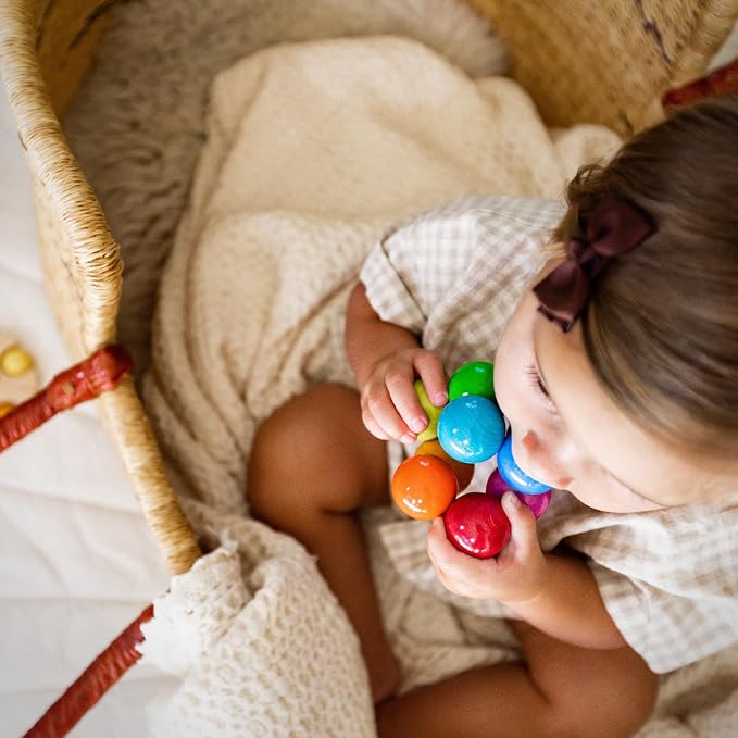 HABA Magica Wooden Grasping Toy Rattle - Baby Teething & Sensory Toy | This wooden teether helps babies develop motor skills and sensory exploration, making it a great Montessori baby gift.