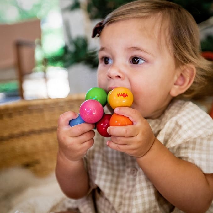 HABA Magica Wooden Grasping Toy Rattle - Baby Teething & Sensory Toy | This wooden teether helps babies develop motor skills and sensory exploration, making it a great Montessori baby gift.